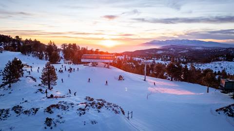 Snow Valley drone shot of the top of Chair 1 during dusk with the sun setting